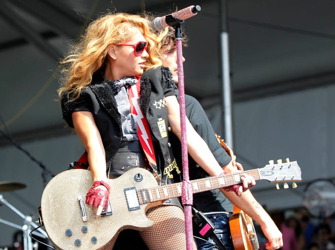 Paulina Rubio performs at the New Orleans Jazz and Heritage Festival in New Orleans, Saturday, May 5, 2012. (AP Photo/Gerald Herbert)