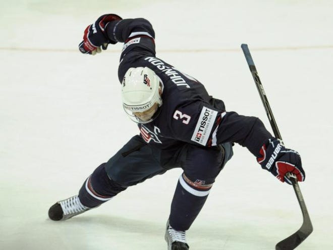 Jack Johnson celebrates his overtime goal in the preliminary round match Canada vs USA during the 2012 IIHF Ice Hockey World Championships in Helsinki, Saturday, May 5, 2012.