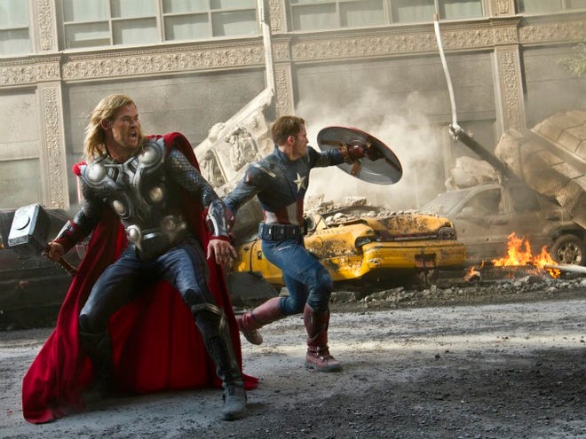 In this film image released by Disney, Chris Hemsworth portrays Thor, left, and and Chris Evans portrays Captain America in a scene from "The Avengers." (AP Photo/Disney, Zade Rosenthal)