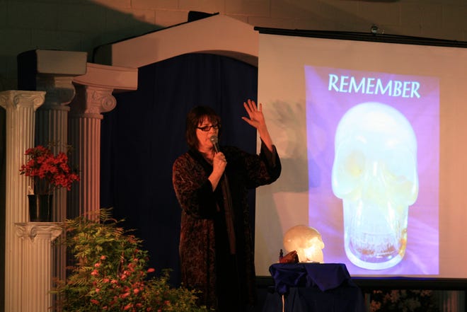 Carolyn Ford and her crystal skull “Einstein,” during her Saturday evening presentation at Wesak 2012 in the Sisson Gymnasium in Mount Shasta. Ford said the skull is an ancient artifact that she kept without speaking about it in public for 20 years -- until the 10/10/10 crystal skull event in New York City. Now she is sharing the 33 pound skull and spreading a message of knowing yourself and loving yourself. "Love is the all access pass," she said during an interview before taking the stage. Ford is scheduled to give another Wesak presentation Sunday from 6 to 7:15 p.m.