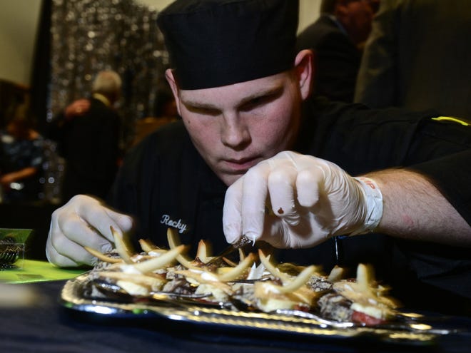 Rodney Yochheim, a student of culinary arts program at the Community Technical & Adult Education, prepares a dish during the Taste of Ocala at the College of Central Florida on Saturday in Ocala.
