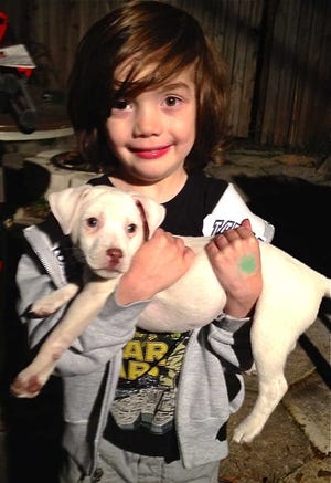 Oliver Sapp and his new puppy, Bolt.