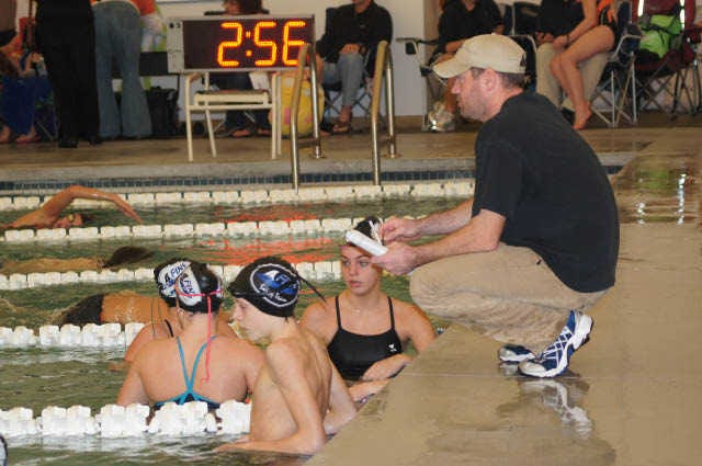 Photo by Mary Beth Lyons/For Bluffton Today  Coach Eric Kemeny gives last minute instructions during warm-ups of the H2A Last Chance Swim Meet.