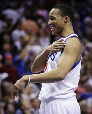 The Sixers' Evan Turner smiles at the end of Sunday's 89-82 victory over the Bulls in Game 4 of the first-round series. The Sixers lead, 3-1.
