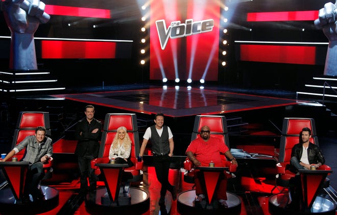 In this Oct. 28, 2011 file photo, from left, judge Blake Shelton, host Carson Daly, judge Christina Aguilera, producer Mark Burnett, judge Cee Lo Green, and judge Adam Levine, from the "The Voice", pose for photographers in Culver City, Calif.