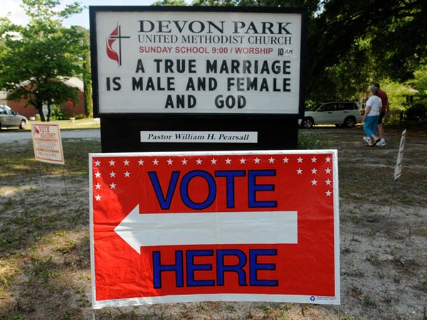 This sign in front of the Devon Park United Methodist Church polling site created a storm of controversy Tuesday.