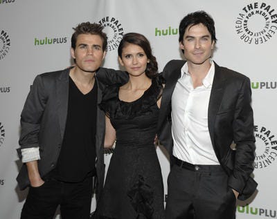 Actor Paul Wesley, left, actress Nina Dobrev , center, and actor Ian Somerhalder arrive at the Paleyfest panel discussion of the television series "The Vampire Diaries" in Beverly Hills, Calif. on Saturday, March 10, 2012. (AP Photo/Dan Steinberg)