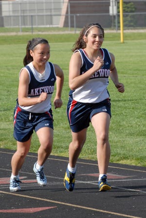 Lakewood's Emily Wilson and Lora Lee Burrus compete in a race Tuesday in Perry.