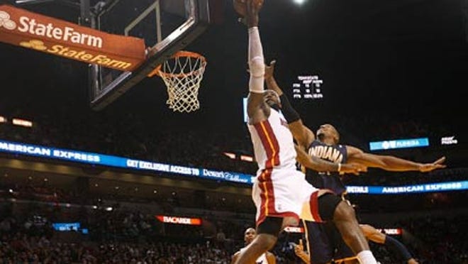 LeBron James goes in for a reverse layup in a game against the Pacers in January.