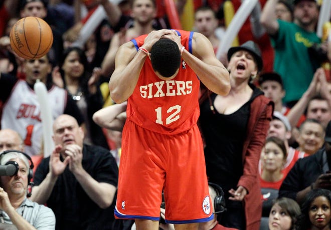 Philadelphia 76ers guard Evan Turner (12) reacts after he fouled during the third quarter of Game 5 in an NBA basketball first-round playoff series against the Chicago Bulls in Chicago on Tuesday, May 8, 2012. The Bulls won 77-69.