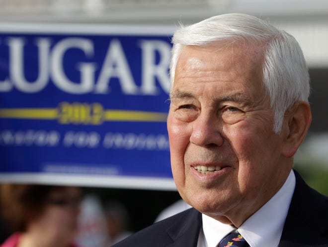 Sen. Richard Lugar meets with voters outside of a polling location Tuesday, May 8, 2012, in Greenwood, Ind. Lugar is being challenged by two-term state Treasurer Richard Mourdock. (AP Photo/Darron Cummings)