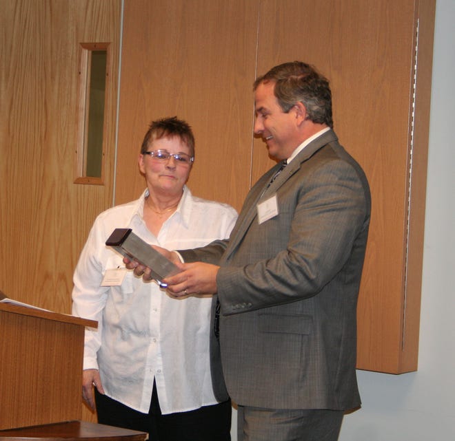 The Tony Balice Clinic in Ionia was recipient of the 2012 Friend of Community Mental Health Distinguished Partner Award. Ionia Mayor Dan Balice (right) accepts the award on behalf of the clinic from Deborah McPeek-McFadden, board chairperson of the Ionia County Community Mental Health Authority.