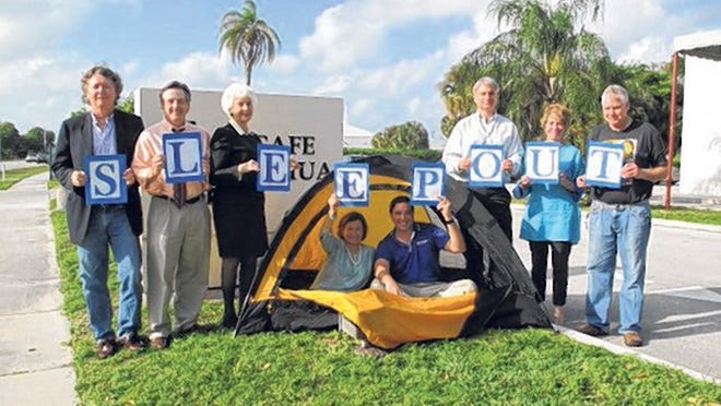 From left, Lord’s Place board members Steve Malone, Bert Winkler, Joyce McLendon, Diana Barrett, David Unversaw, Kelly Moore, Pamela McIver and Dean Lavallee spell out 'SLEEPOUT’ in preparation of this weekend’s annual fundraiser at Meyer Amphitheater.
