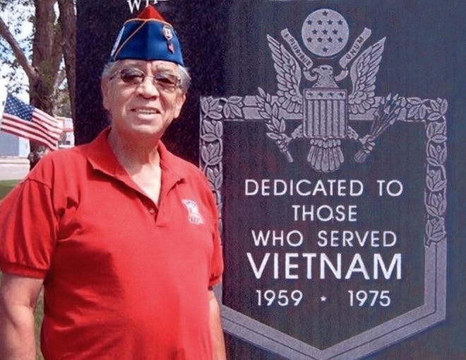 Anthony ‘Tony’ Martinez stands next to a plaque honoring Vietnam War veterans. Martinez, an avid advocate for military veterans, died last week at age 62.