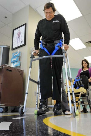 Photos by Bob.Self@jacksonville.com At Brooks Neuro Recovery Center, Steve Cohen works to walk a lap of the room. He can be found at the rehabilitation center most weekdays, and a staffer says his "go-get-them" attitude is inspiring to the other patients.