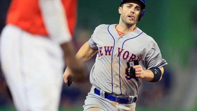 David Wright, who had four hits in the Mets' 9-3 win over the Marlins on Saturday, heads into third base standing up on a sixth-inning single by Lucas Duda.