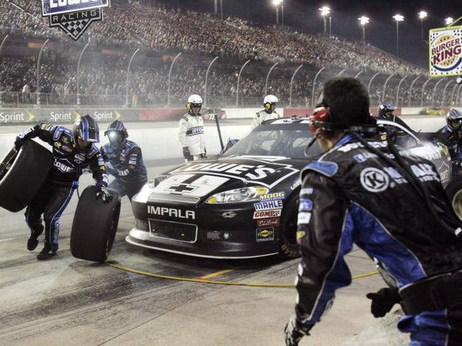 Jimmie Johnson's pit crew works on his car during the NASCAR Sprint Cup Series auto race at Darlington Raceway, Saturday, May 12, 2012, in Darlington, S.C.