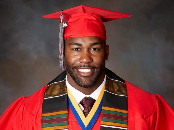 Former Gator football player Andra Davis poses after graduating from UNLV on Saturday. (Photo courtesy of UNLV)