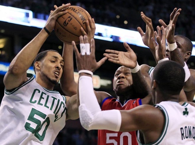 The Celtics' Ryan Hollins (left) controls a loose ball as the Sixers' Lavoy Allen (50) and Boston's Rajon Rondo (right) close in Saturday night. Allen had 12 points and six rebounds in a 92-91 Game 1 loss.