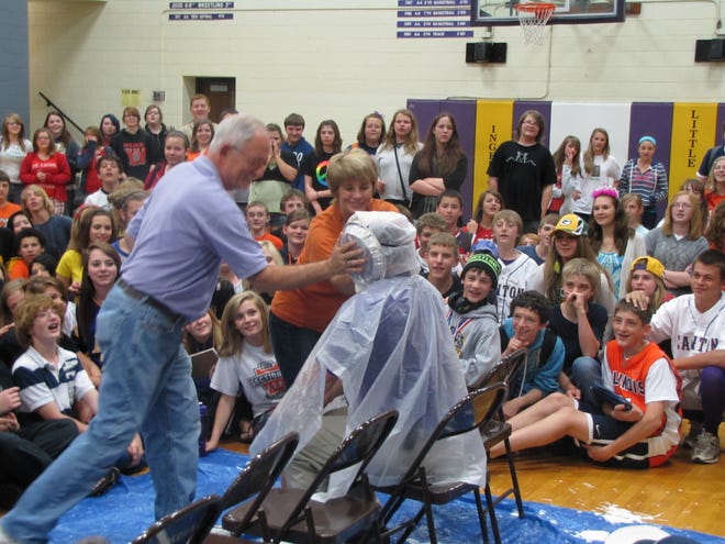 Retiring faculty members Mr. McCance and Mrs. Burie celebrate the final Spirit Day at Ingersoll Middle School by giving Principal Wayne Krus a pie in the face. Several other faculty members were also chosen by students for this "honor."