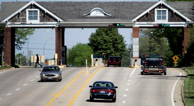 Vehicles pass through the toll booths on the Bauer Toll Bridge on Thursday, May 10, 2012, in Machesney Park.