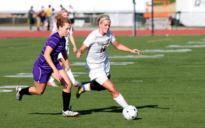 Rock Bridge’s Carmen Boessen, right, battles for the ball with Hickman’s Erin Forsythe during the Bruins’ 1-0 win in Tuesday night’s Class 3 District 9 Tournament semifinal.