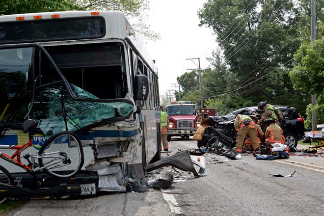 Emergency workers respond to a head-on collision between a Rockford Mass Transit Bus and a Toyota RAV 4 on Thursday, May 17, 2012, on Spring Brook Road just west of Windsong Drive in Rockford.