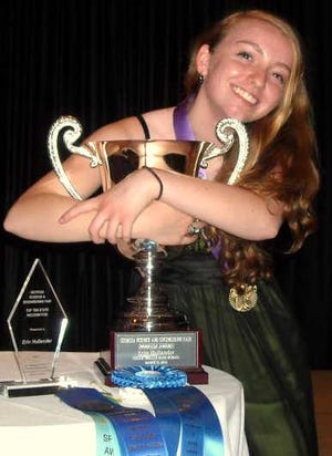Erin Hollander poses with awards she won during the Georgia Science and Engineering Fair on March 23 at the Georgia Center in Athens. After placing first in the state fair Hollander moved on to the International Science and Engineering Fair held May 13-18 in Pittsburgh.