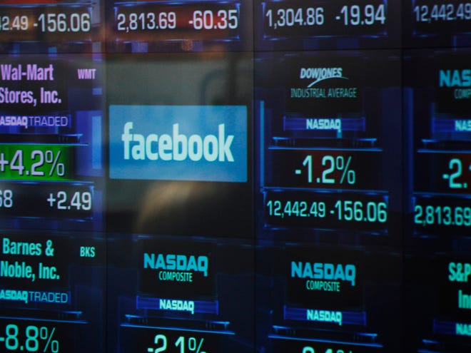 The Facebook logo appears on a display inside the NASDAQ Marketsite in Times Square Thursday in New York. Facebook priced its IPO at $38 per share on Thursday, at the high end of its expected range. If extra shares reserved to cover additional demand are sold as part of the transaction, Facebook Inc. and its early investors stand to reap as much as $18.4 billion from the IPO.