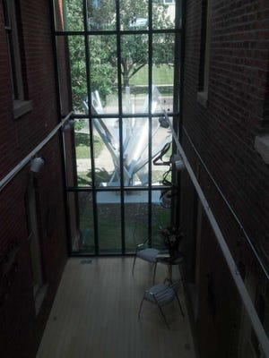The sculpture by Sebastian Trovato that stood in the White Lakes Mall for decades can be seen through the atrium of the new Swinnen & Associates law office.