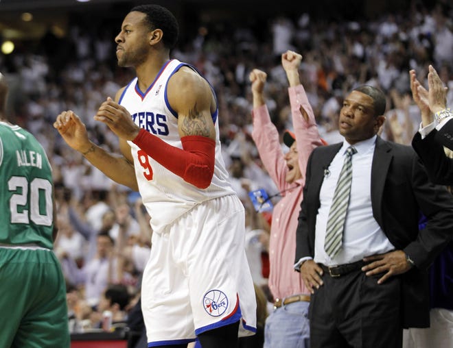 76ers forward Andre Iguodala reacts after his basket as Celtics coach Doc Rivers (right) looks on in the second half of Boston's Game 4 loss last night.