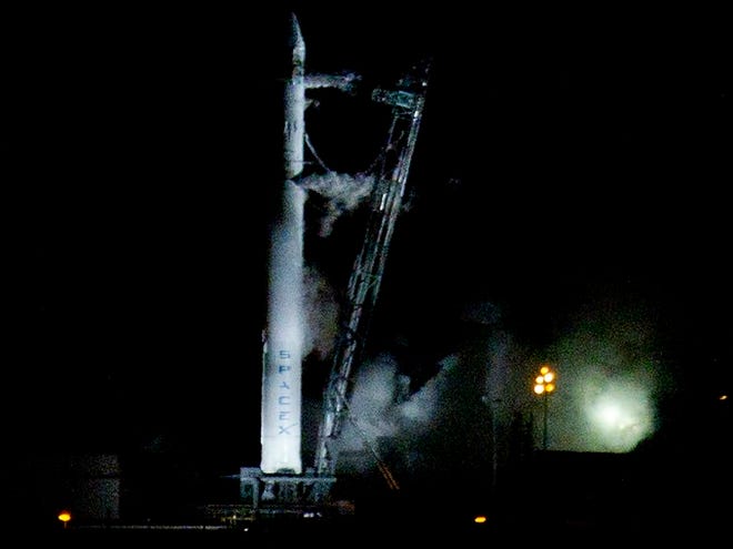 The Falcon 9 SpaceX rocket sits on the launch pad at complex 40 moments after the launch was aborted due to technical problems at the Cape Canaveral Air Force Station early Saturday, May 19, 2012. (AP Photo/John Raoux)