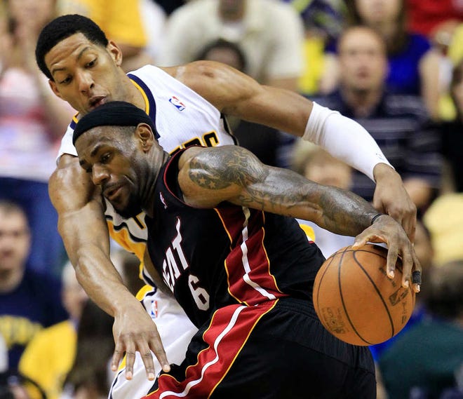 Miami's LeBron James (6), is pressured Sunday by Indiana's Danny Granger.
