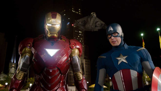This file photo of a film image released by Disney shows Iron Man, portrayed by Robert Downey Jr., left, and Captain America, portrayed by Chris Evans, in a scene from "The Avengers." Disney and Marvel's "The Avengers" should top domestic box office for a third straight weekend, fending off wide-release newcomers with another $50 million in receipts.