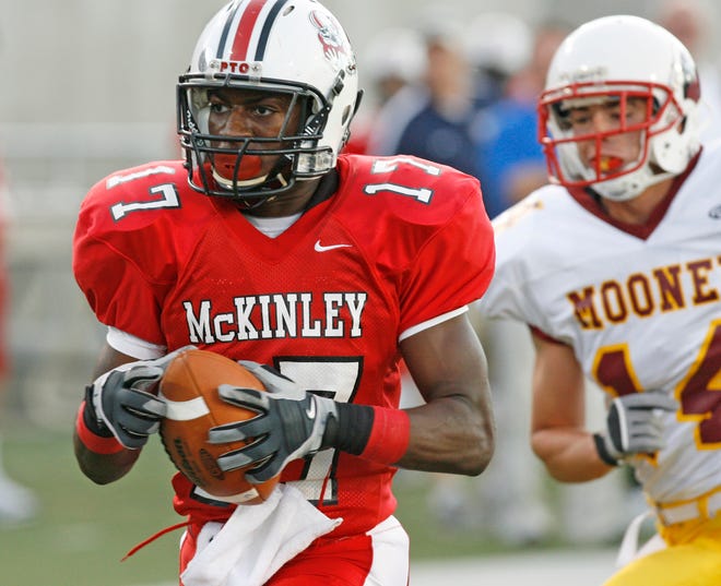 McKinley’s Zach Sweat hauls in a long touchdown pass during a 2011 game against Cardinal Mooney. With the failure of the competitive balance referendum last week, there could be renewed interest in separating the public schools and the private schools.