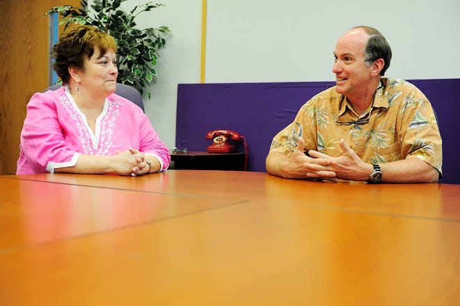 History teacher Dixie Grupe and science teacher Dan Miller talk Monday about Columbia Public Schools’ new teaching assignments for 2013. Grupe and Miller will remain at Hickman High School, but some teachers will move to different buildings when Battle High School opens.