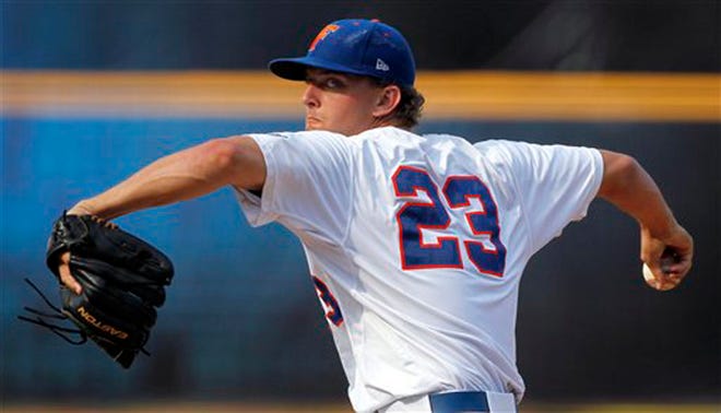 Florida's Jonathon Crawford pitches against Auburn in the second inning of an NCAA college baseball game during the Southeastern Conference tournament in Hoover, Ala., Tuesday, May 22, 2012. (AP Photo/Dave Martin)
