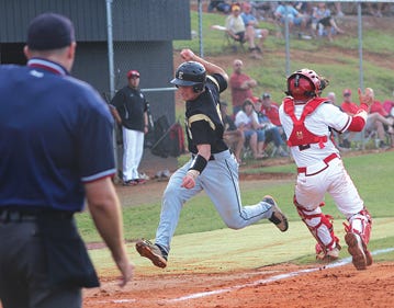 East Davidson's Nathan Campbell scores a run in the Golden Eagles' fourth-round 2-A state playoff game against East Rutherford on Tuesday in Forest City.