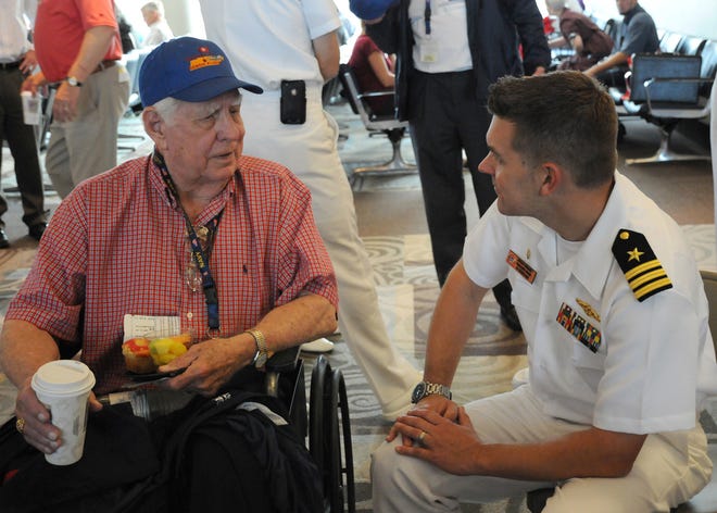 Cmdr. Richard Dubnansky speaks with a World War II veteran at the send-off.