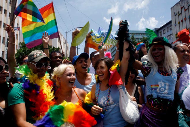 Mariela Castro, daughter of Cuba's President Raul Castro, front row second from right, participates in events leading up to the International Day Against Homophobia in Havana in May 2010. Prominent academics say the 49-year-old Cuban first daughter has carved out an important name for herself that goes beyond her family lineage or famous last name, making gay rights her life's cause.