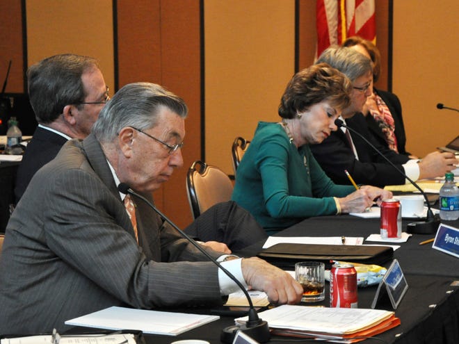 David Touchton, foreground, interim regional chancellor at the University of South Florida Lakeland, and USF President Judy Genshaft, take notes during a meeting Wednesday of the Select Committee on Florida Polytechnic University.