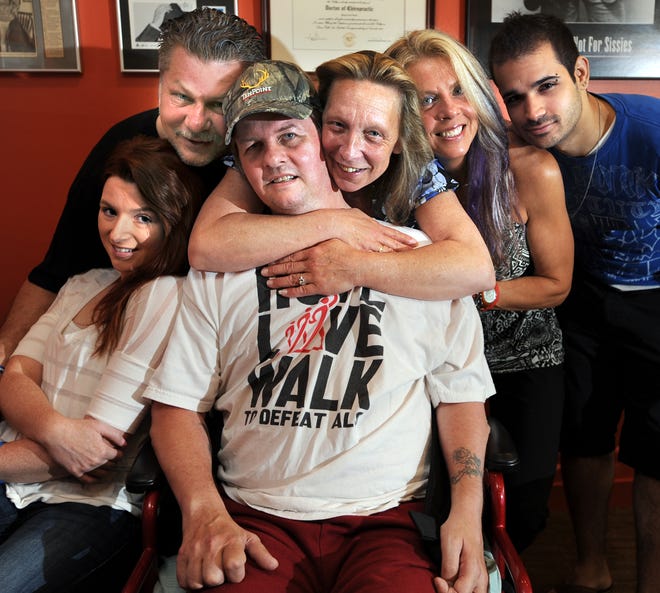 A fundraiser will be held Saturday for Stephen Malieswski of Natick, center, who has ALS. With Malieswski are, from left, his daughter, Kimberly Ann Sa, brother John, girlfriend Mary Brewer, sister Susan Quirk and son-in-law Mayckel Sa.