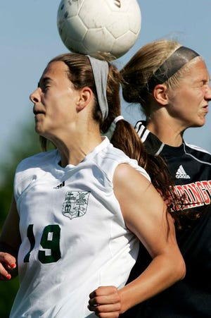 Boylan's Sutton Wester (19) and Barrington's Emily Morin (9) go up for the ball Tuesday, May 22, 2012, during the Class 3A girls semifinal soccer match at Boylan High School in Rockford.