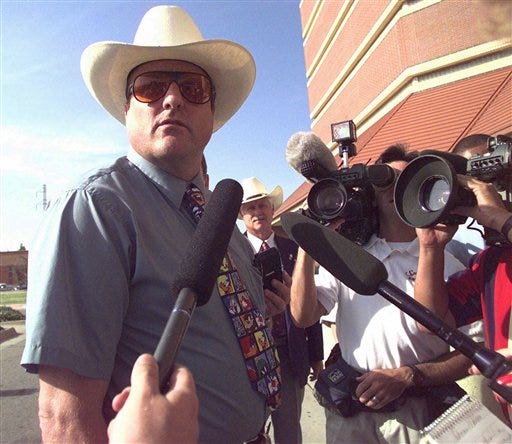 In this July 16, 1997, file photo, Dennis Mahon, a white supremacist from Davis Junction talks to reporters before appearing before the Oklahoma County Grand Jury in Oklahoma City. Mahon was convicted in a 2004 bombing that injured a black city official. Mahon was found guilty in February 2012 of three federal charges and faces between seven and 100 years in prison.