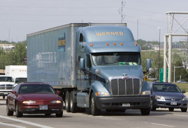 A Werner Enterprises truck travels on Interstate 680 west of Omaha, Neb., in this May 13, 2009 file photo. Truckload carriers including Werner should benefit from a better housing market. (AP Photo/Nati Harnik)