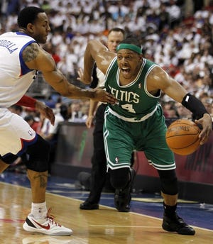The Sixers' Andre Iguodala (left) defends against the Celtics' Paul Pierce during the first half of Game 4 on Friday.