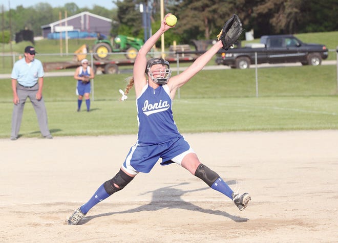 Ionia’s Ashleigh Babcock fires a pitch toward the plate Monday during the Bulldog’s doubleheader against St. Johns. Babcock will play her final home games today.