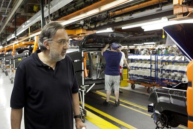Chrysler Chief Executive Officer Sergio Marchionne watches as vehicles are assembled Thursday, May 24, 2012, during a visit to the Belvidere Assembly Plant in Belvidere.