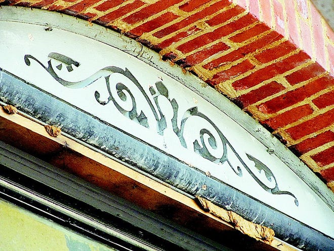 What it is: ornate wooden scrollwork viewed through elaborate scaffolding above windows exposed after the famous Tibbits Opera House was “stripped."