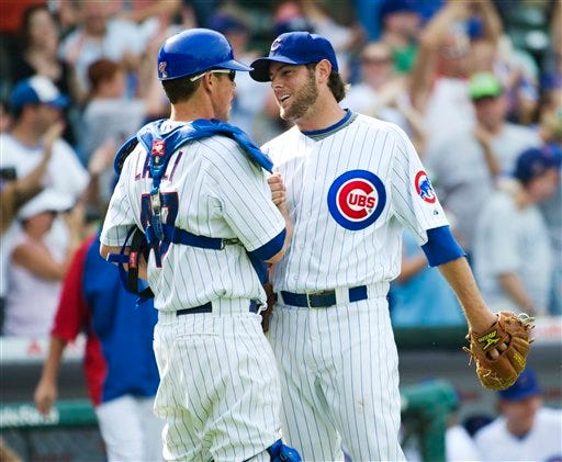 Chicago Cubs catcher Blake Lalli, left, and relief pitcher Casey Coleman celebrate their 11-7 win over the San Diego Padres after a baseball game, Monday, May 28, 2012, in Chicago. (AP Photo/Brian Kersey)